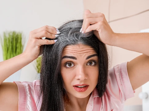 Who is likely to experience premature greying?